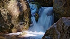 Waterfall among boulders