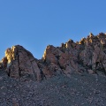 Rocky ridge above tarns in morning sunlight