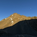 Sunlit unnamed peak 2,222 metres and the Moon