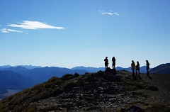 Silhouette of trampers on Mt Bruce