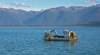 Fishing boat and West Coast mountains