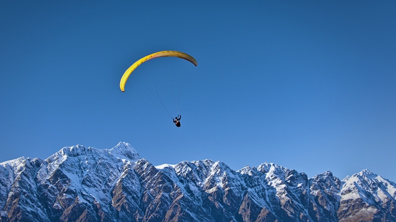 Paraglider above Remarkables range
