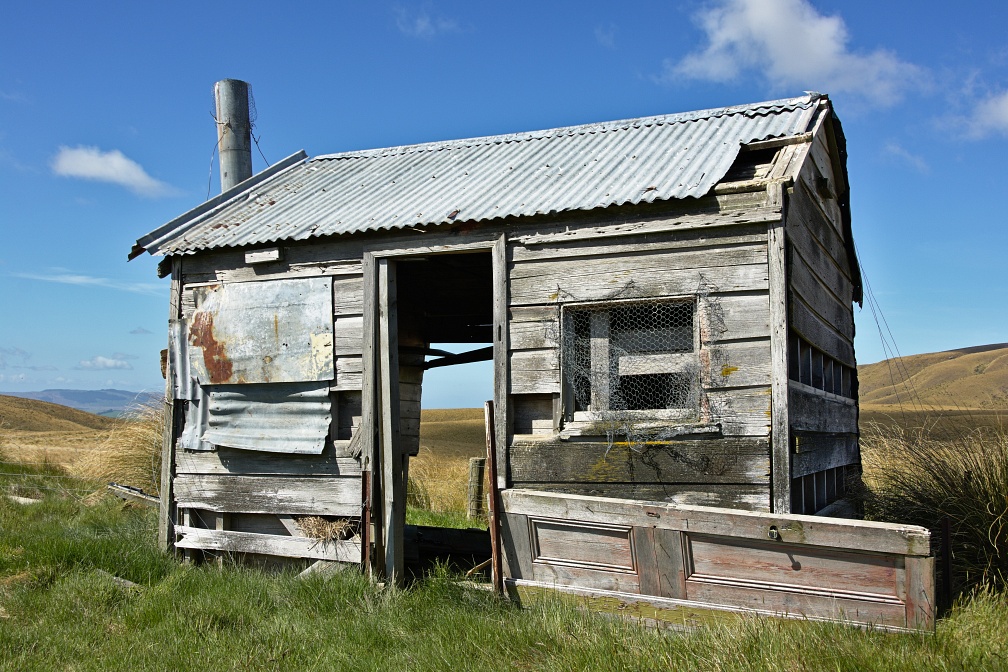 Derelict cottage in farmland
