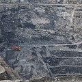 Red digger in Macraes gold mine