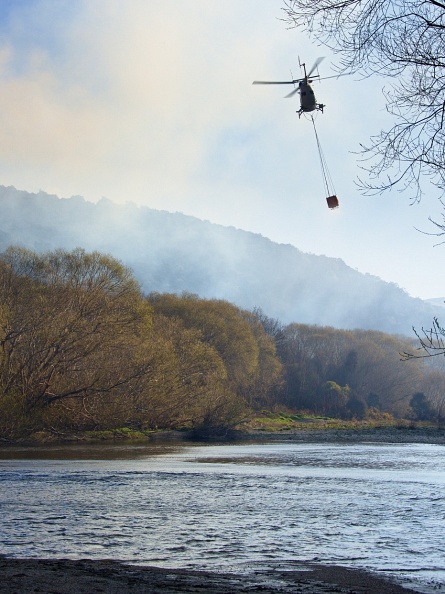 Helicopter taking water to a bushfire