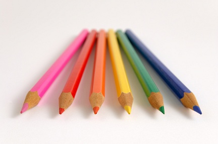Colour pencils evenly spread on flat surface