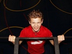 Young sportsman performing pull-ups