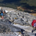 Climbing through granite rock boulders area