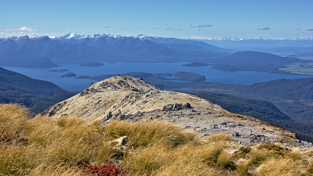 Tussock and granite sand of Mount Titiroa, Lakes Manapouri and T