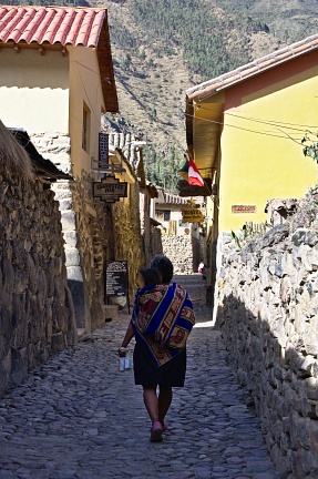 Woman carrying a baby in Ollantaytambo