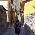 Woman carrying a baby in Ollantaytambo