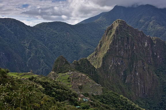 Machu Picchu city ruins and Huayna Picchu ruins and mountain