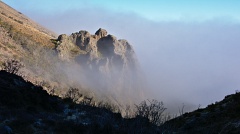 Rock formation along Mt Somers Track in fog