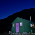 Cameron Hut at night with Southern Cross