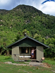 Tramper at Teal Bay Hut