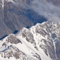 Detail of snowy and rocky mountain ridge from the air
