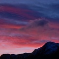Dramatic red clouds and snowy peaks