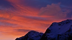 Dramatic red sky in Winter mountains