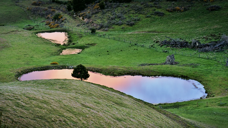 Ponds with colourful sunrise reflections