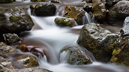 Creek with boulders and silky smooth water