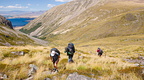 Tramping party following poled route